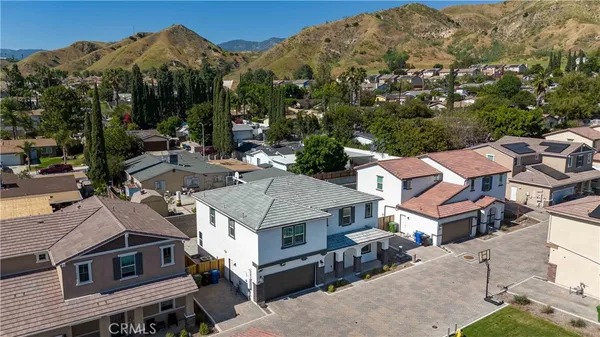 an aerial view of residential houses and outdoor space