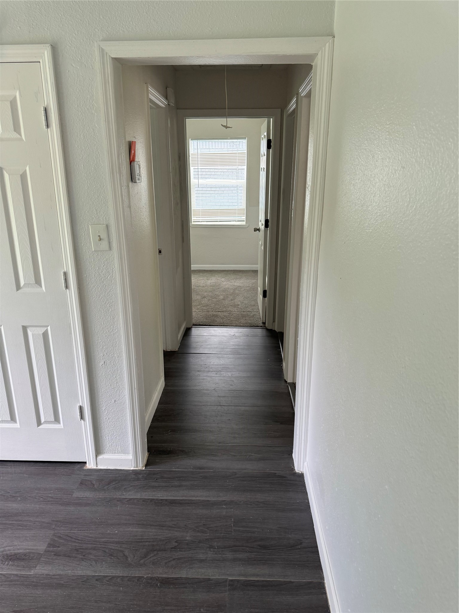 4215 Botany Lane Houston, TX 77047 - Photo 13 of 23 a view of a hallway with wooden floor