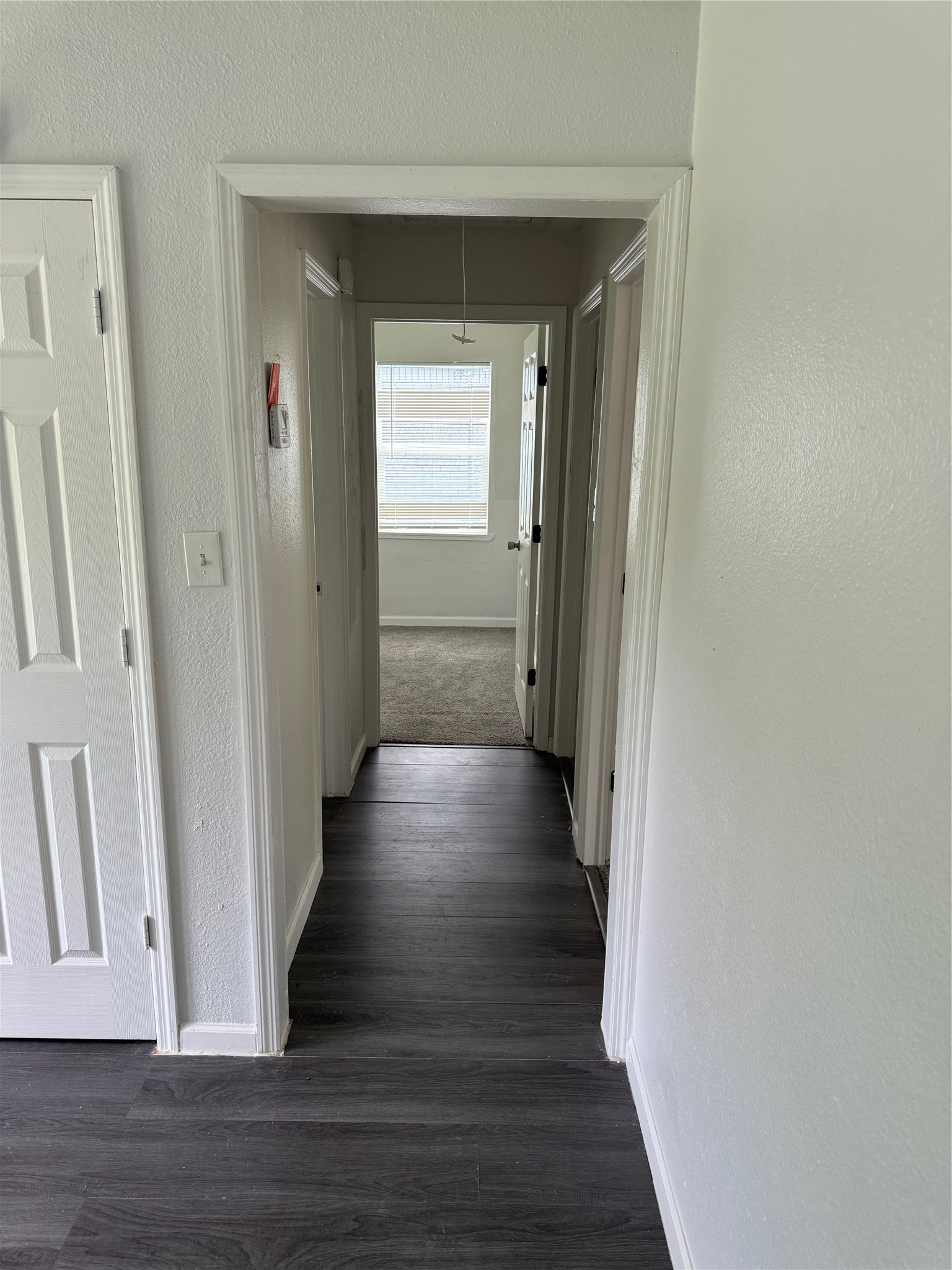 4215 Botany Lane Houston, TX 77047 - Photo 14 of 23 a view of a hallway with wooden floor