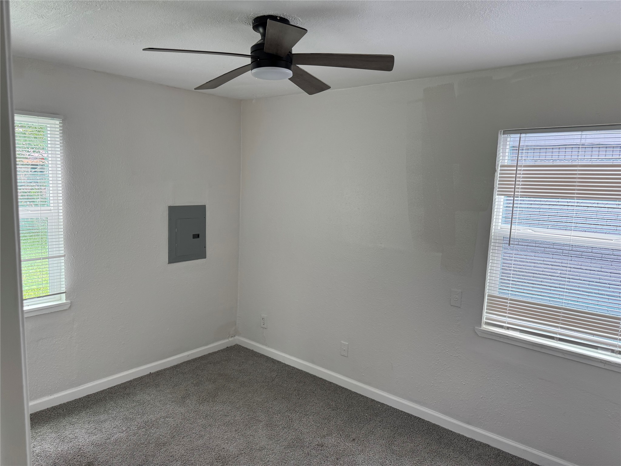 4215 Botany Lane Houston, TX 77047 - Photo 20 of 23 an empty room with a window and a fan