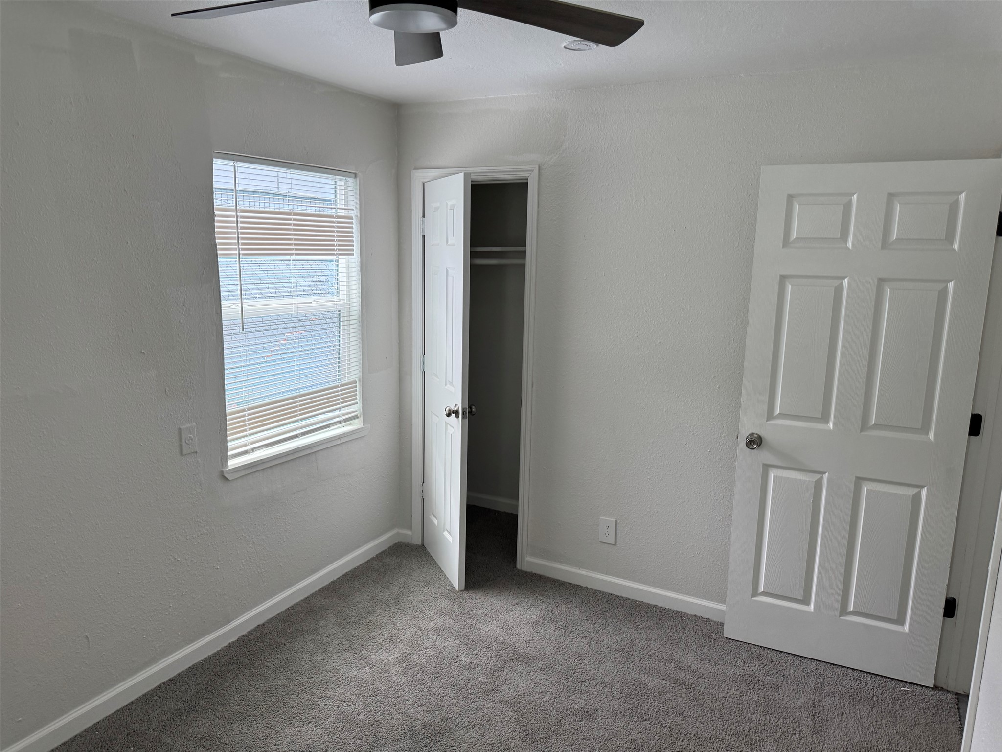 4215 Botany Lane Houston, TX 77047 - Photo 21 of 23 an empty room with windows and closet