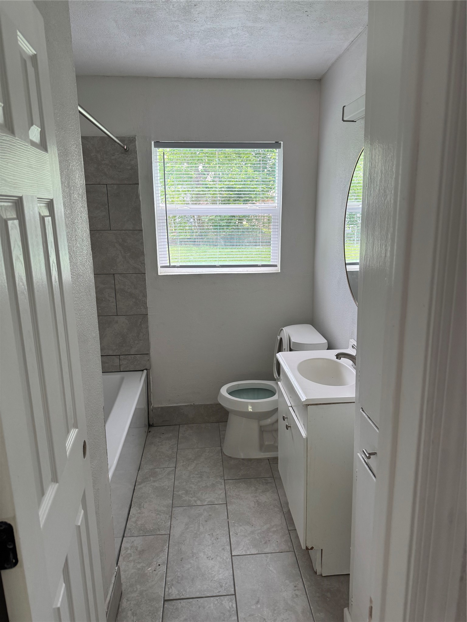 4215 Botany Lane Houston, TX 77047 - Photo 22 of 23 a bathroom with a sink a toilet and a mirror