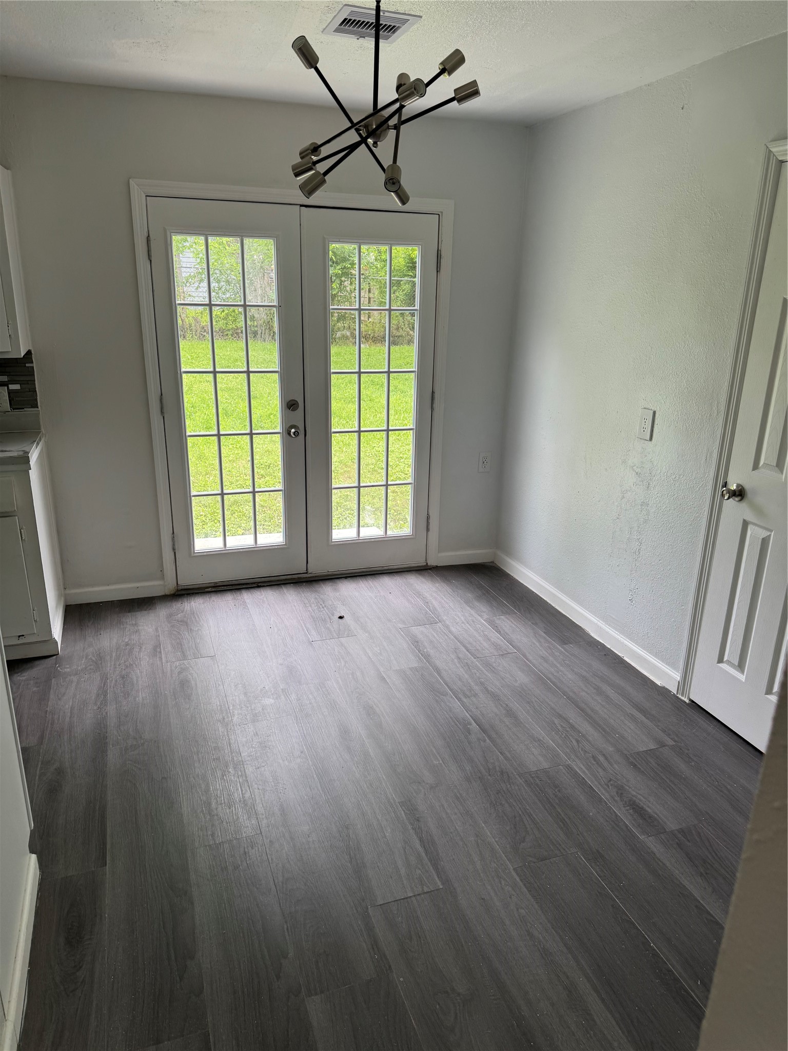 4215 Botany Lane Houston, TX 77047 - Photo 23 of 23 a view of an empty room with wooden floor and a window