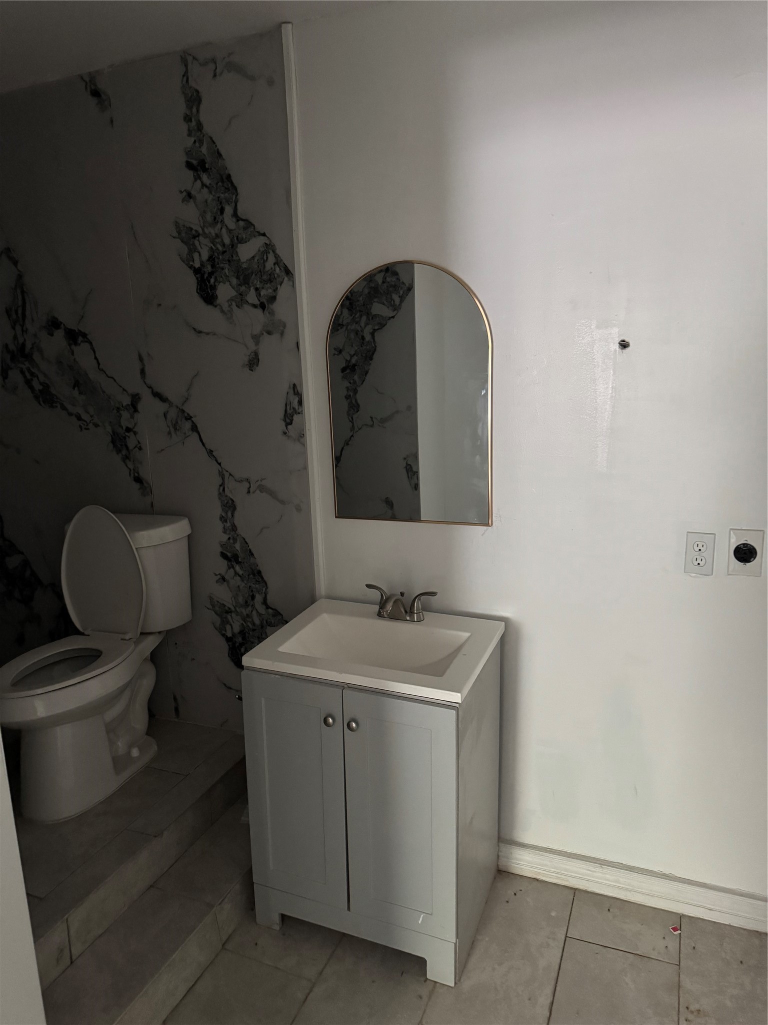 4215 Botany Lane Houston, TX 77047 - Photo 10 of 23 a bathroom with a toilet sink and mirror