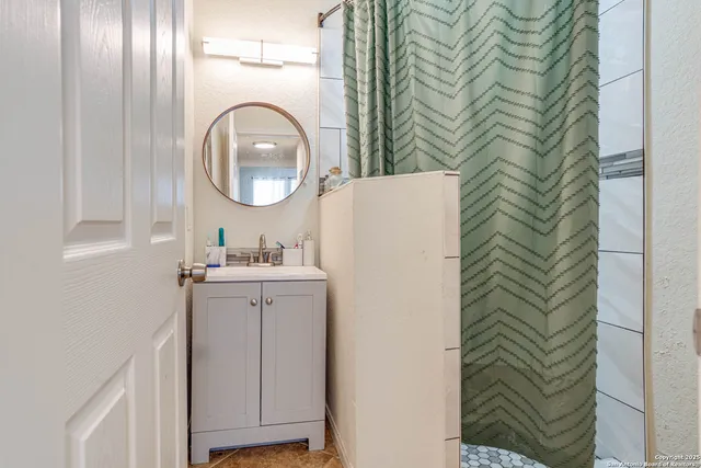 a bathroom with a sink a mirror and a toilet