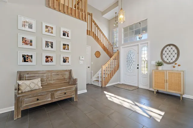 a dining room with furniture and window