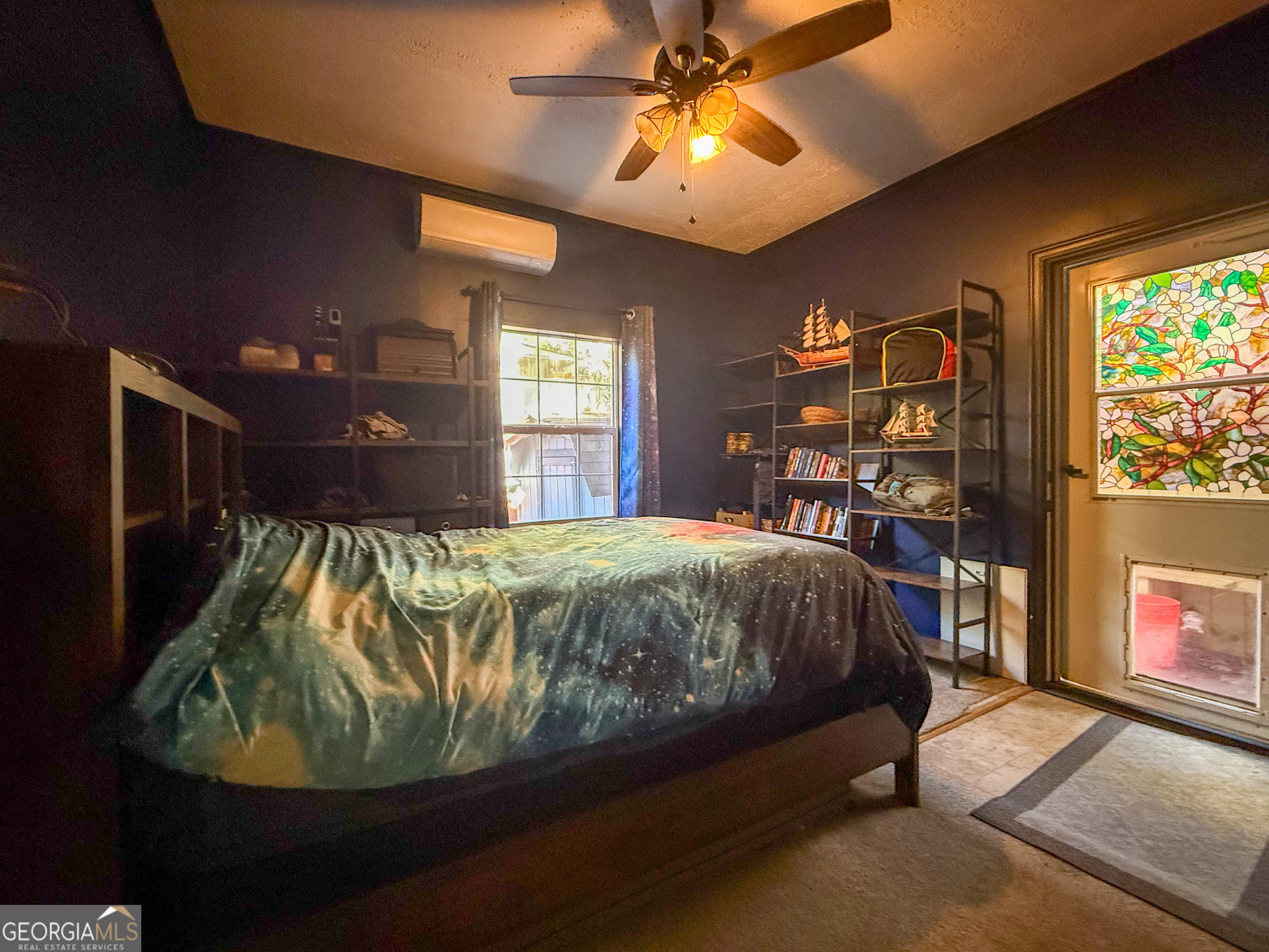 61 Rocky Lane Cleveland, GA 30528 - Photo 14 of 20 a bed sitting in a bedroom next to a window