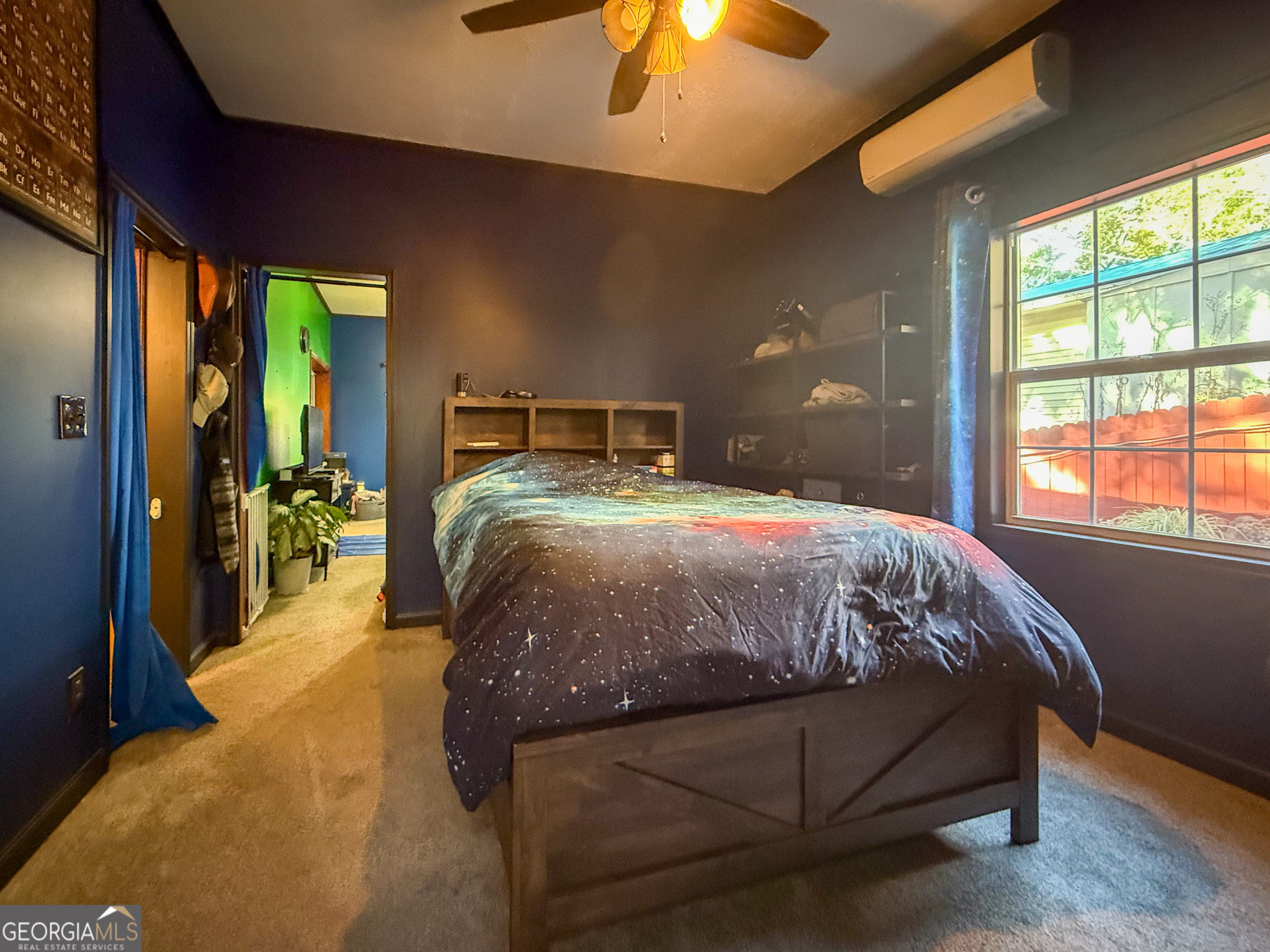 61 Rocky Lane Cleveland, GA 30528 - Photo 15 of 20 a bed sitting in a bedroom next to a window