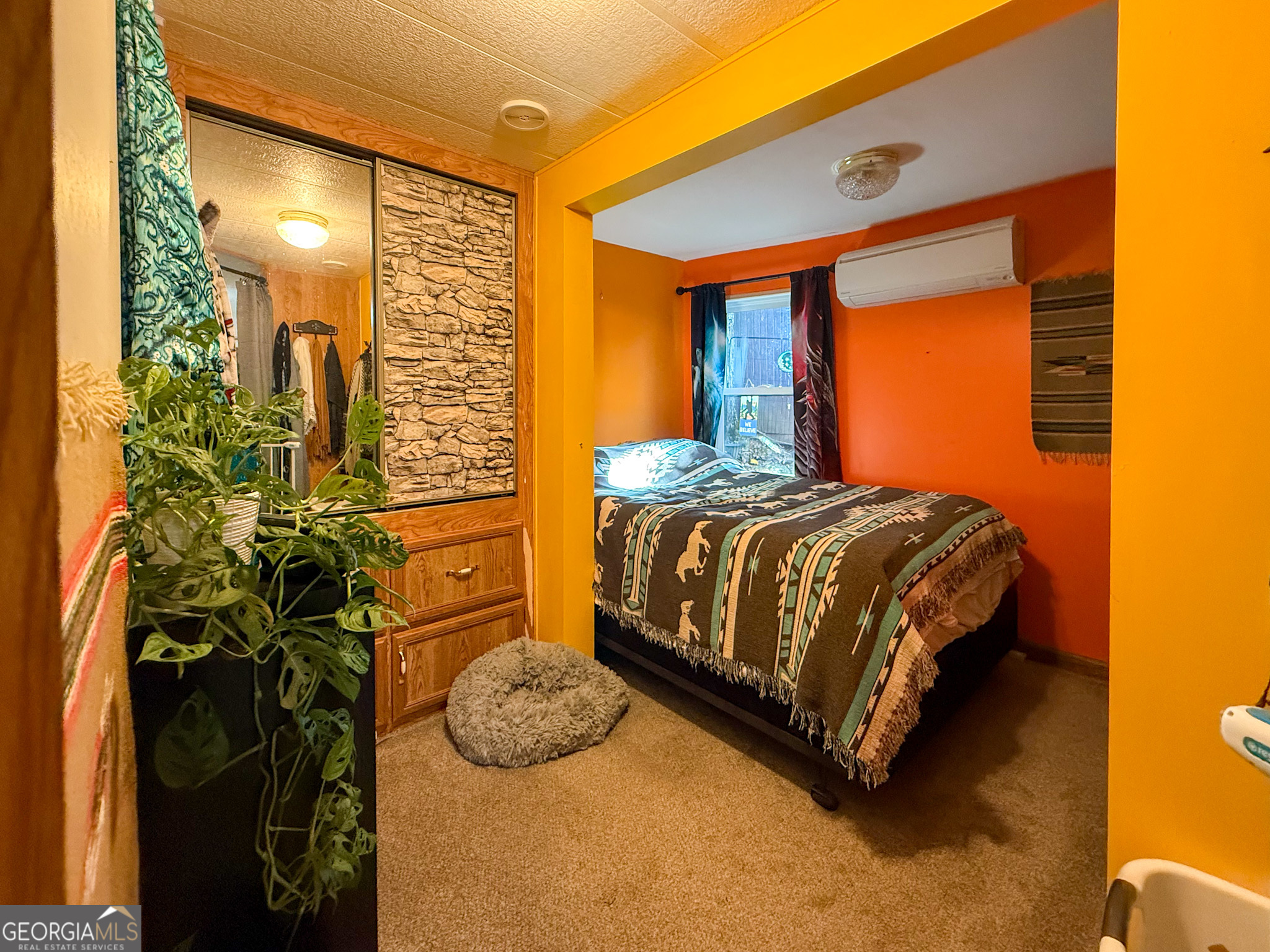 61 Rocky Lane Cleveland, GA 30528 - Photo 17 of 20 a bedroom with a bed and a mirror