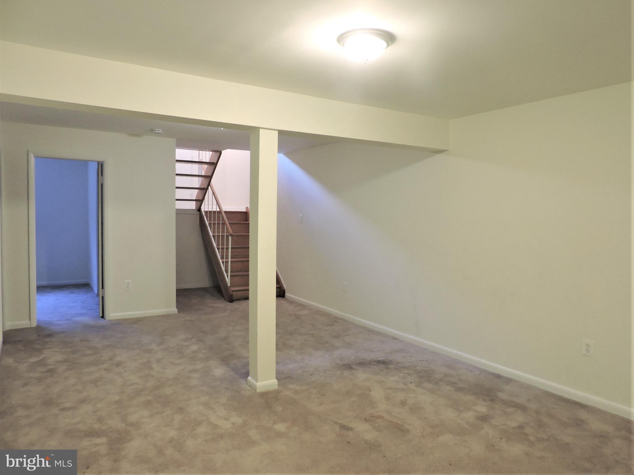 9217 Three Oaks Drive Silver Spring, MD 20901 - Photo 21 of 24 Lower level family room with guest room or study