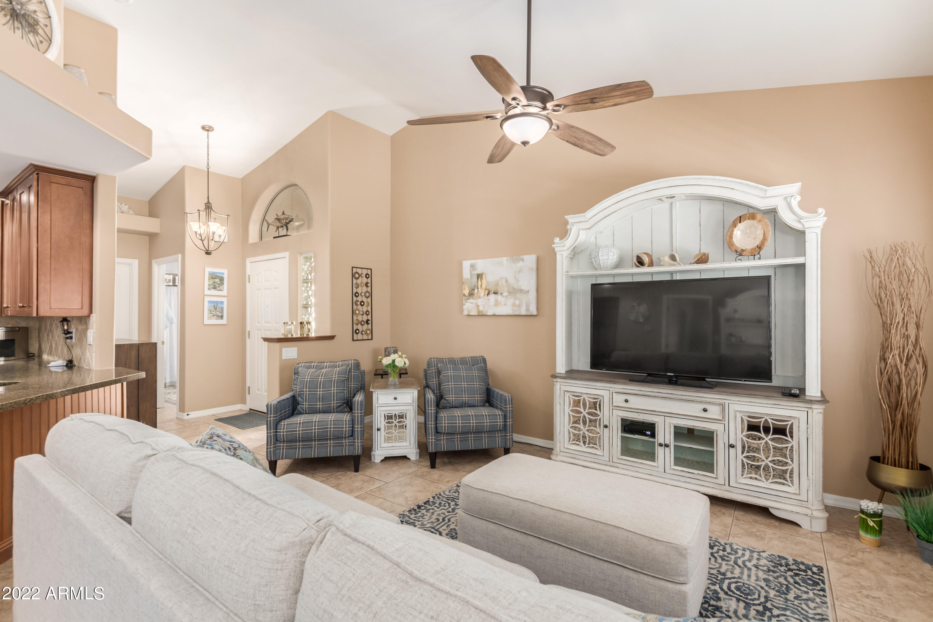 5830 East McKellips Road, Unit 76 Mesa, AZ 85215 - Photo 11 of 33 a living room with furniture and a flat screen tv