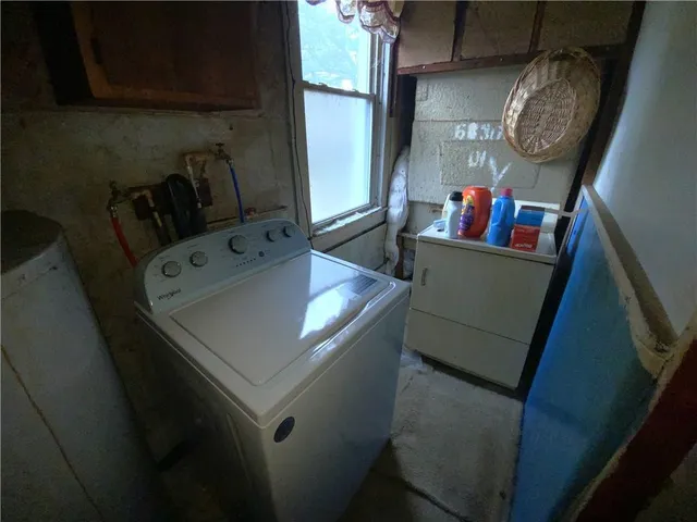 a view of living room with furniture and a window