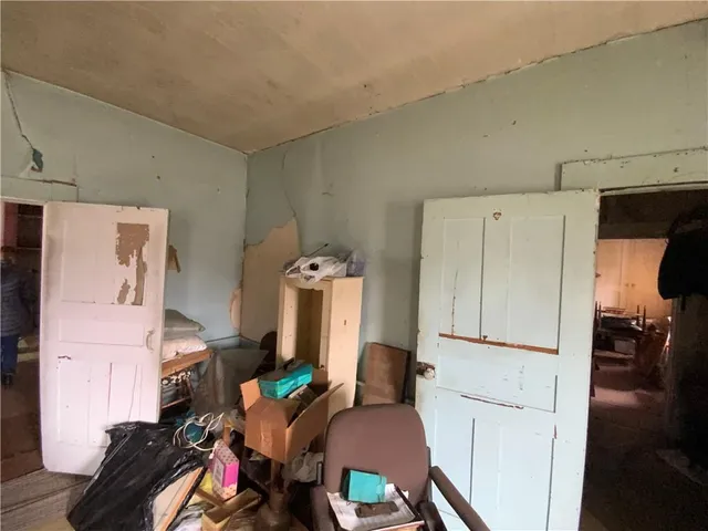 a view of a room with workspace and a couch