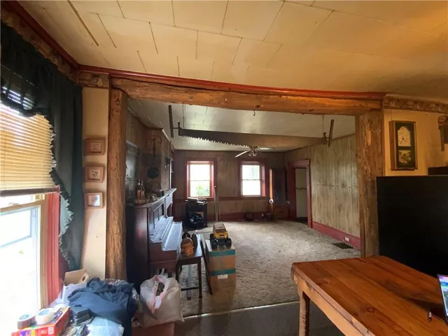 a view of a livingroom with furniture and windows