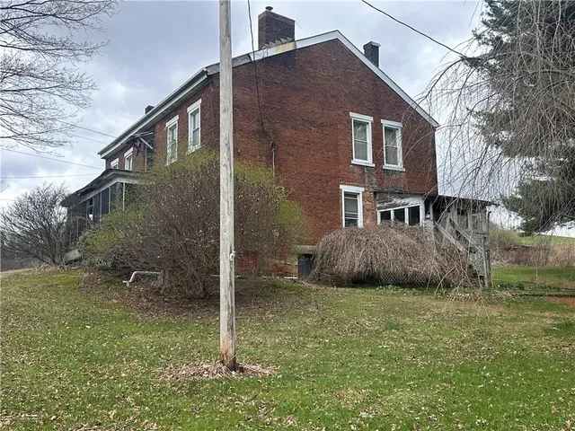 a backyard of a house with lots of green space
