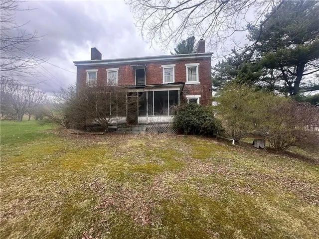 a view of a house with a garden