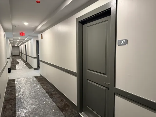 a hallway with wooden door