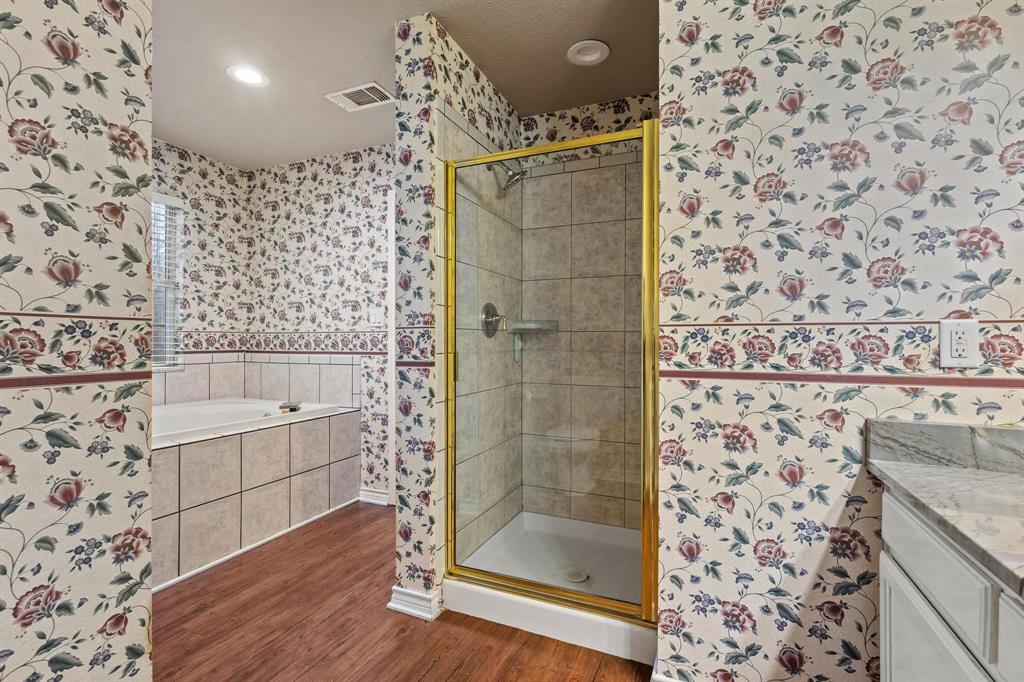 265 Cooks Corner Road Pottsboro, TX 75076 - Photo 16 of 40 a bathroom with a bathtub and a shower