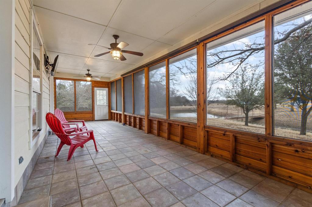265 Cooks Corner Road Pottsboro, TX 75076 - Photo 21 of 40 a living room with furniture and a large window