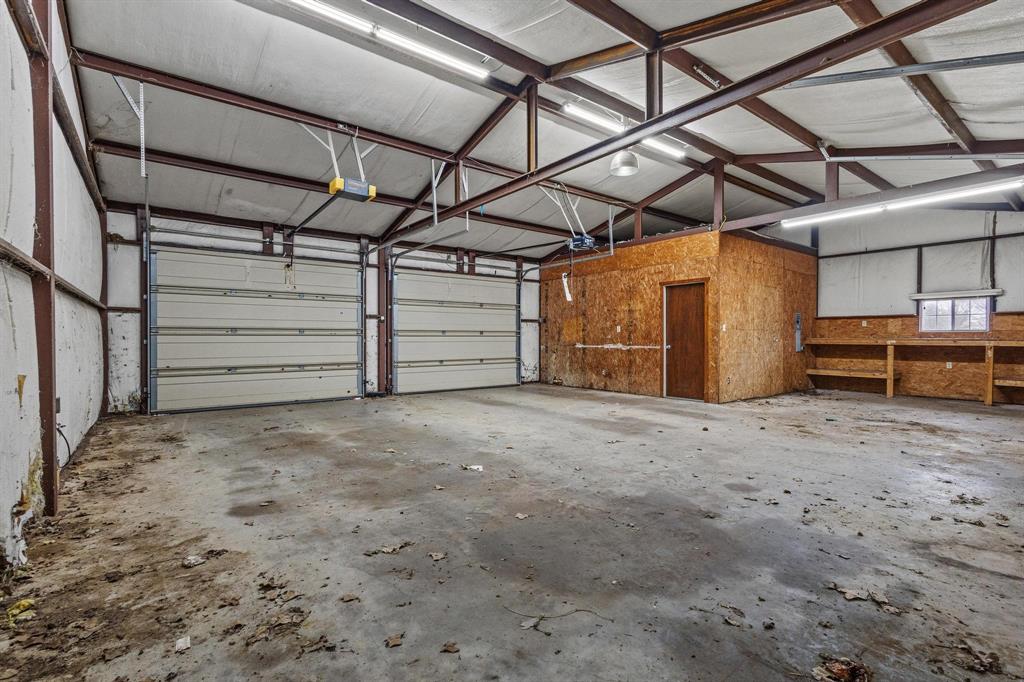 265 Cooks Corner Road Pottsboro, TX 75076 - Photo 25 of 40 a view of a room with wooden walls