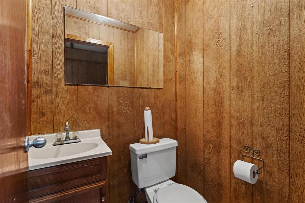 265 Cooks Corner Road Pottsboro, TX 75076 - Photo 27 of 40 a bathroom with a sink a toilet and shower