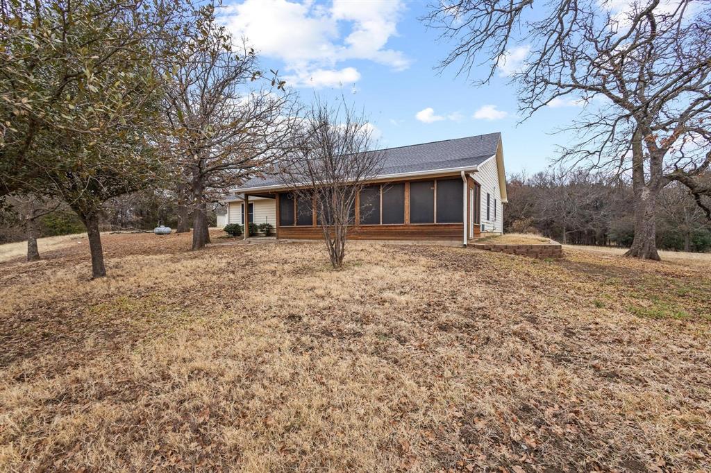 265 Cooks Corner Road Pottsboro, TX 75076 - Photo 29 of 40 a front view of house with yard covered in snow