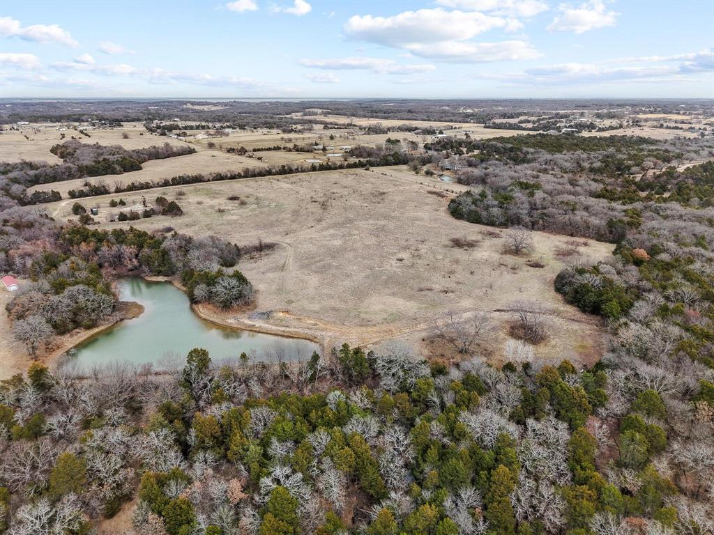 265 Cooks Corner Road Pottsboro, TX 75076 - Photo 37 of 40 an aerial view of a house with a lake view