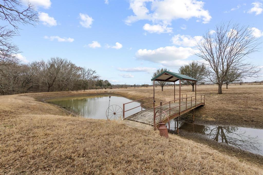 265 Cooks Corner Road Pottsboro, TX 75076 - Photo 4 of 40 a view of swimming pool with a yard and lake view