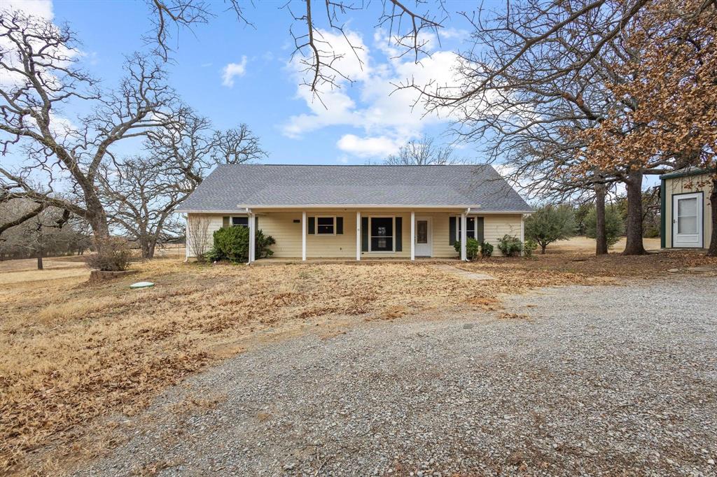 265 Cooks Corner Road Pottsboro, TX 75076 - Photo 6 of 40 a front view of a house with a yard