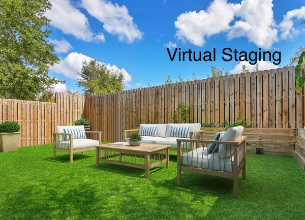 a backyard of a house with table and chairs