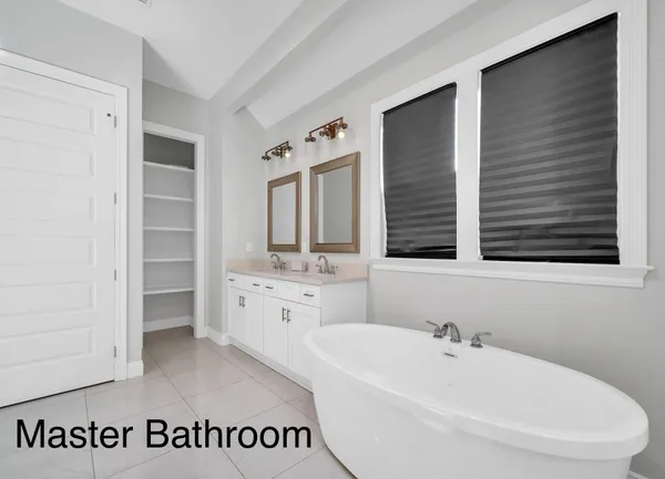 a bathroom with a bathtub and a sink