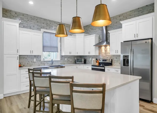 a kitchen with a sink cabinets and window