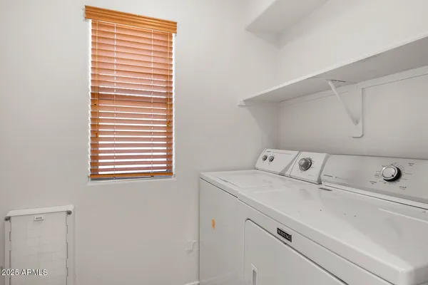 a view of a kitchen with a refrigerator and a cabinets