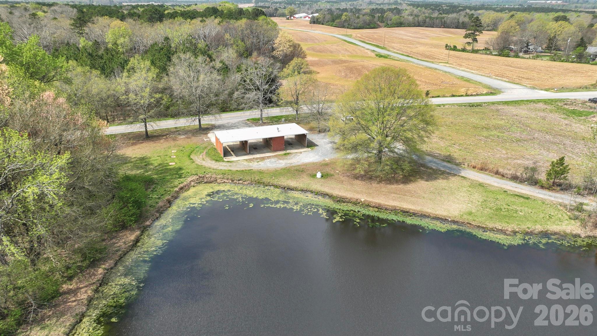 7301 Wolf Pond Road Monroe, NC 28112 - Photo 11 of 14 a view of swimming pool with a yard