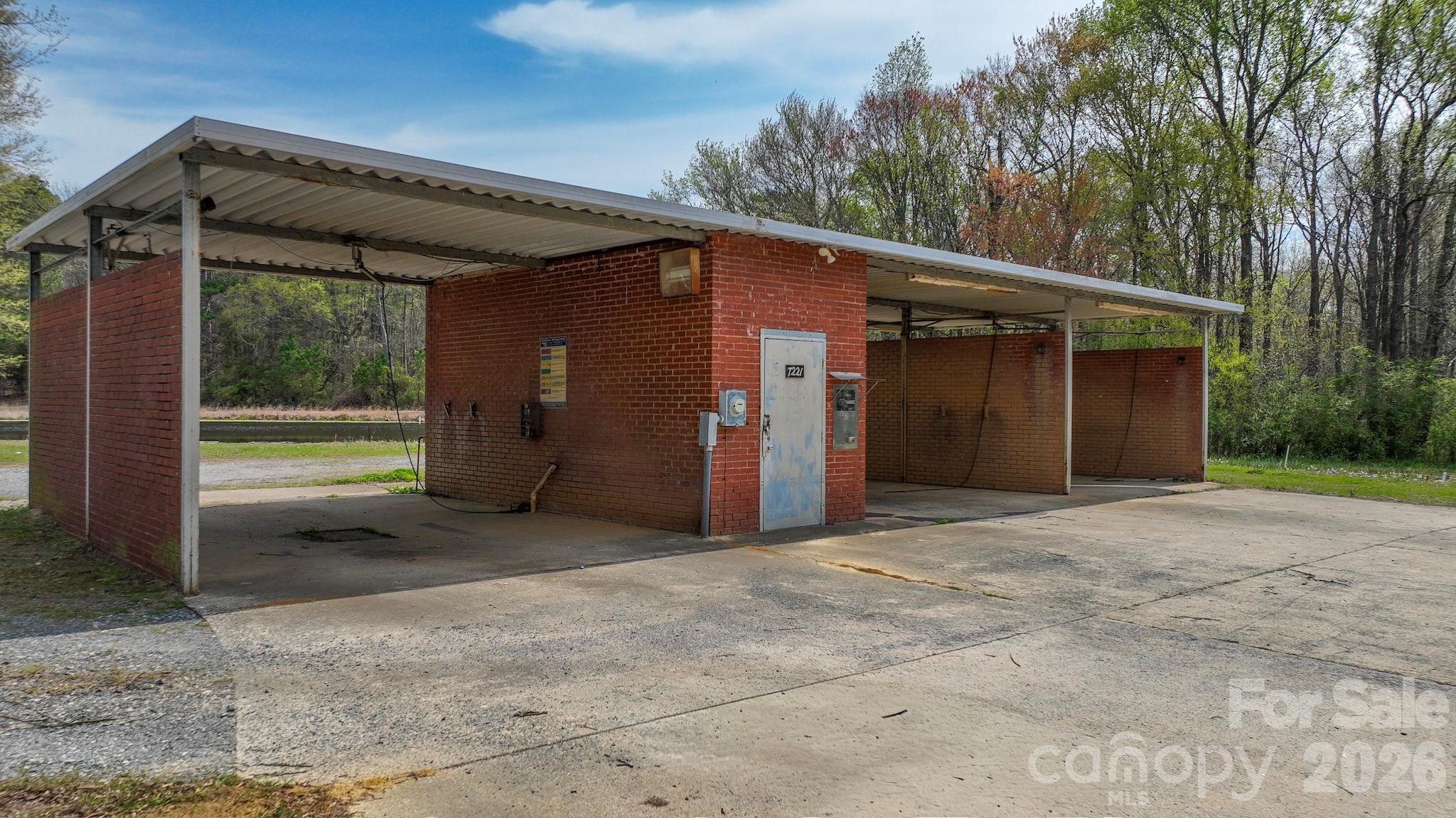 7301 Wolf Pond Road Monroe, NC 28112 - Photo 14 of 14 a backyard of a house with shaded area