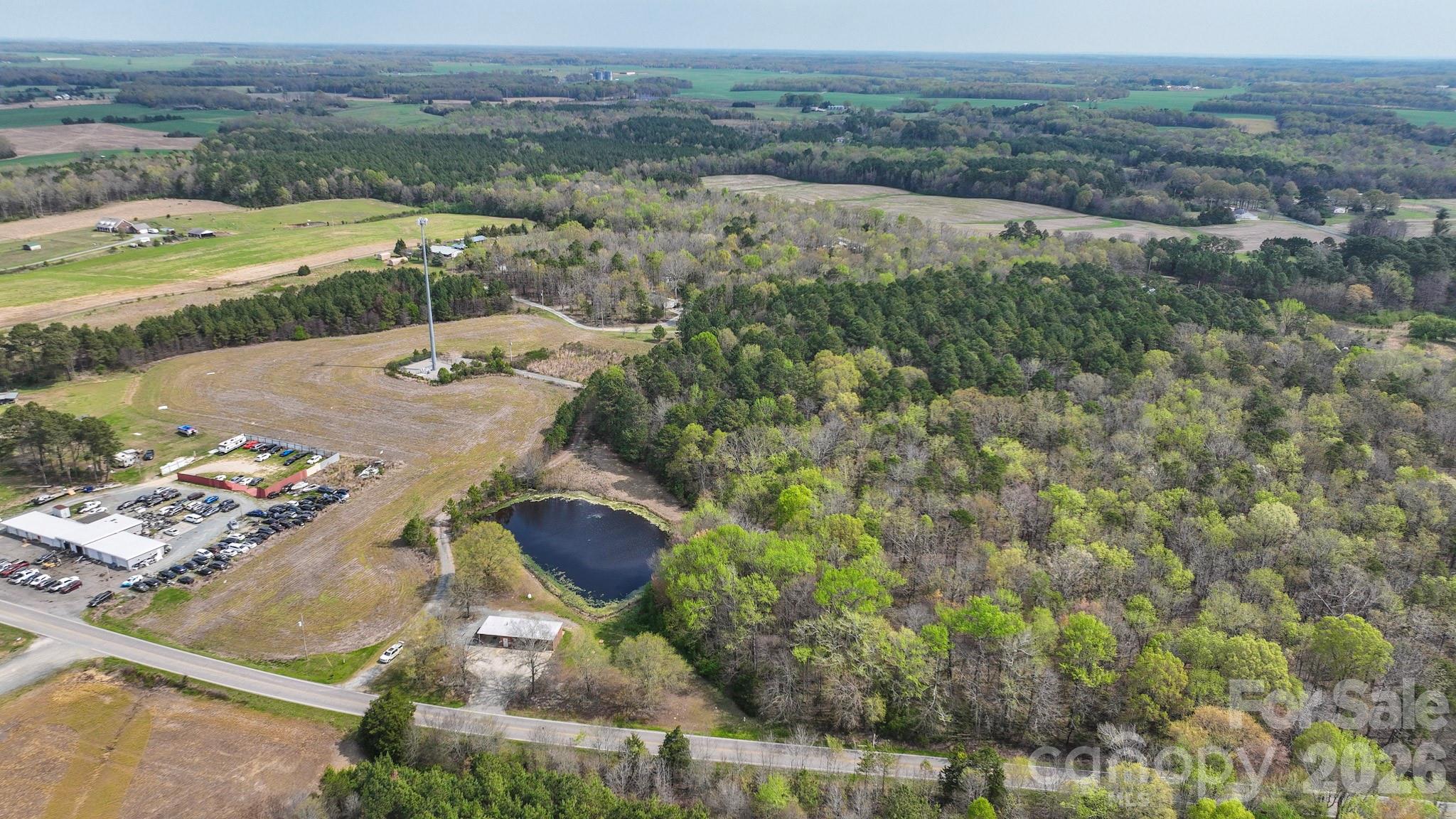 7301 Wolf Pond Road Monroe, NC 28112 - Photo 2 of 14 an aerial view of residential houses with outdoor space