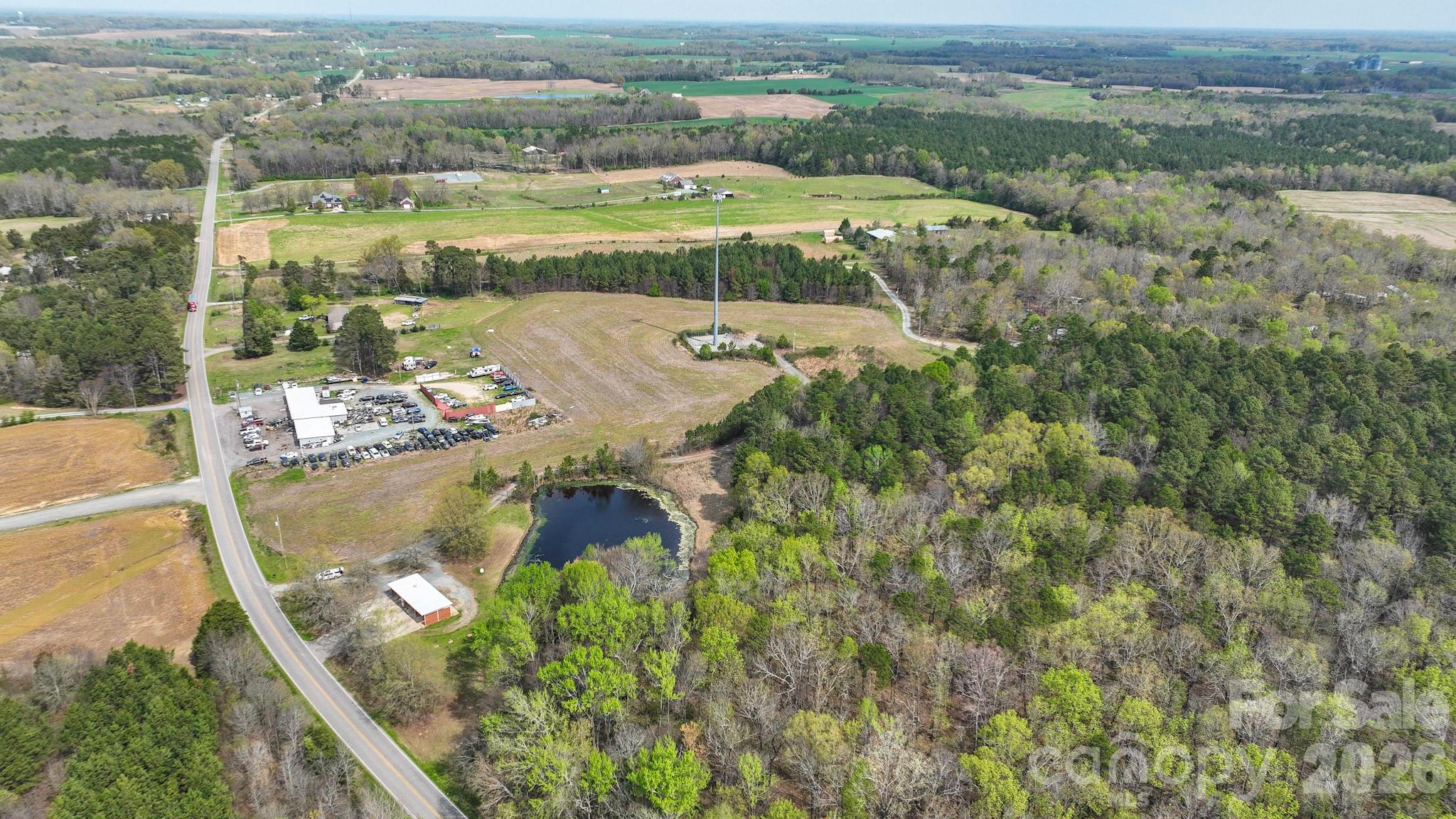 7301 Wolf Pond Road Monroe, NC 28112 - Photo 3 of 14 a view of a lake with a mountain