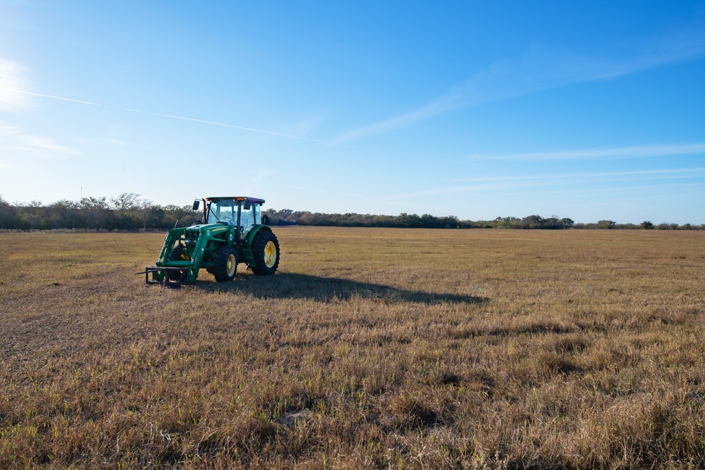 1038 Old Goliad Road Goliad, TX 77963 - Photo 11 of 32 a lake view with a bench in the background