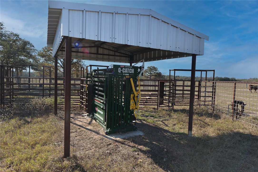 1038 Old Goliad Road Goliad, TX 77963 - Photo 7 of 32 a view of a car park under an umbrella
