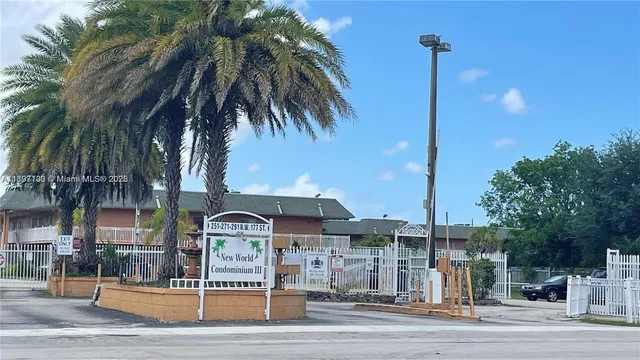 a front view of a building with parking area