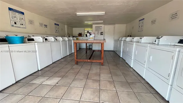 a kitchen with a sink a stove and cabinets