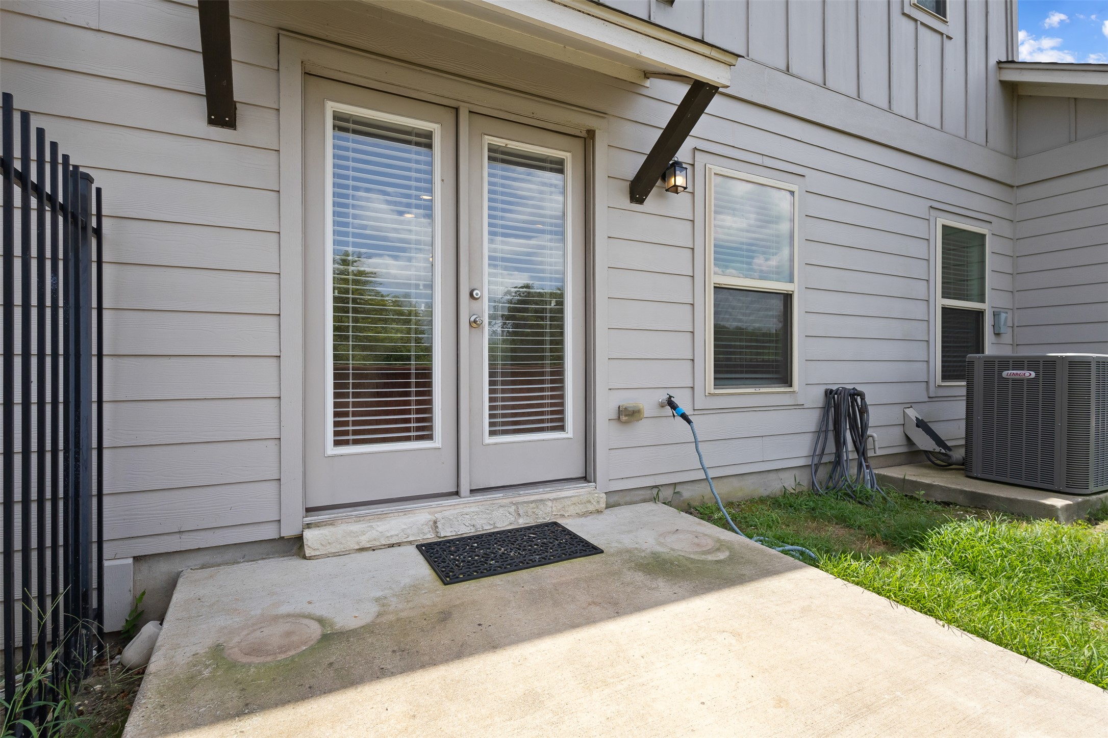 1510 Catalan Road, Unit 602 Austin, TX 78748 - Photo 30 of 36 Doorway to property with a patio area, board and batten siding, and french doors