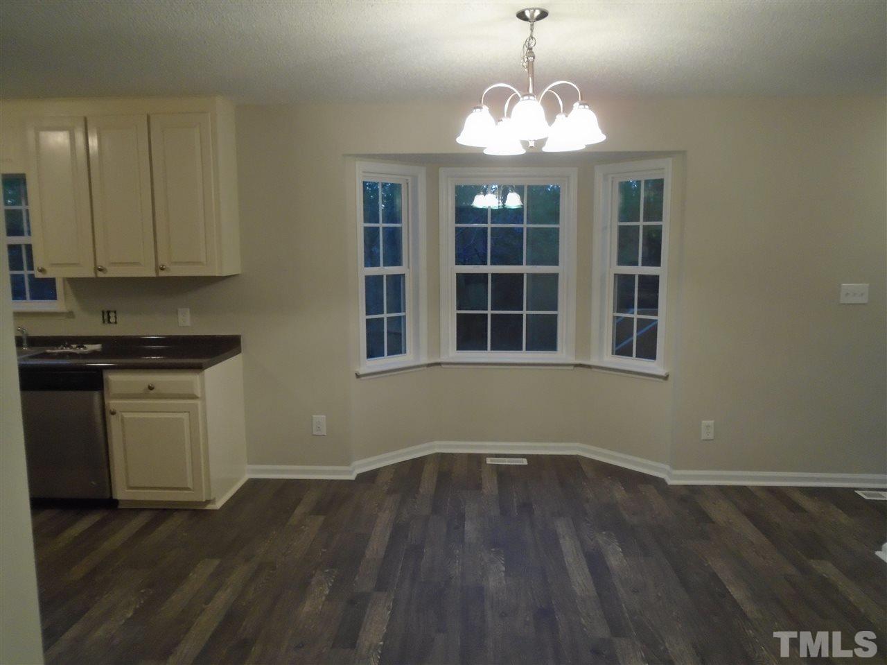 4004 Rockside Hills Drive Raleigh, NC 27603 - Photo 3 of 14 a view of wooden floor and windows in a room
