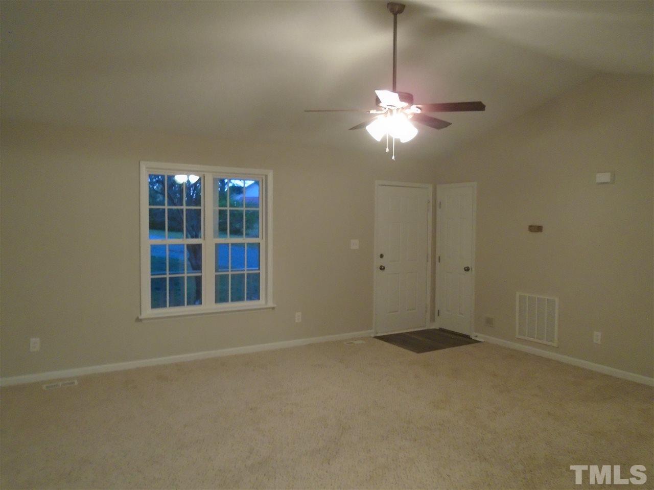 4004 Rockside Hills Drive Raleigh, NC 27603 - Photo 4 of 14 a view of empty room with windows