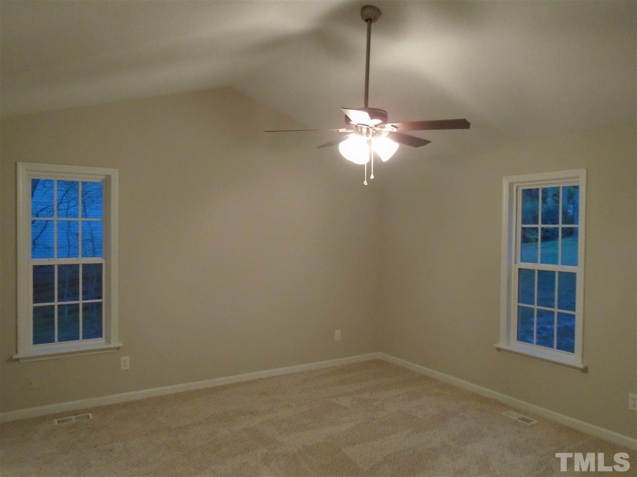 4004 Rockside Hills Drive Raleigh, NC 27603 - Photo 5 of 14 a view of a livingroom with a chandelier