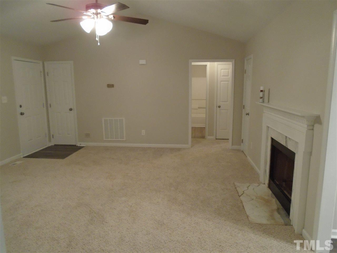 4004 Rockside Hills Drive Raleigh, NC 27603 - Photo 7 of 14 a view of a livingroom with a fireplace