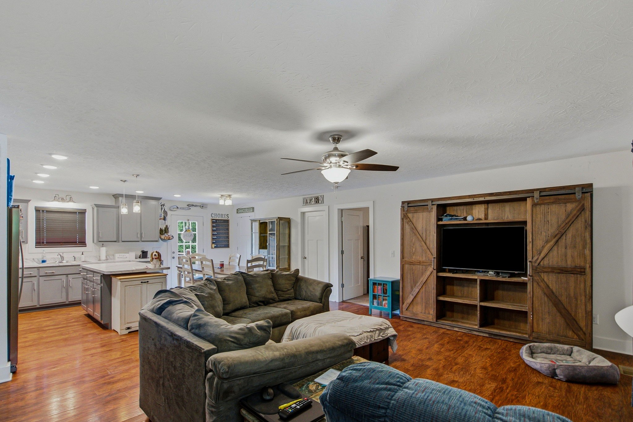 222 Hog Back Ridge Road Bethpage, TN 37022 - Photo 7 of 28 a living room with furniture and a flat screen tv