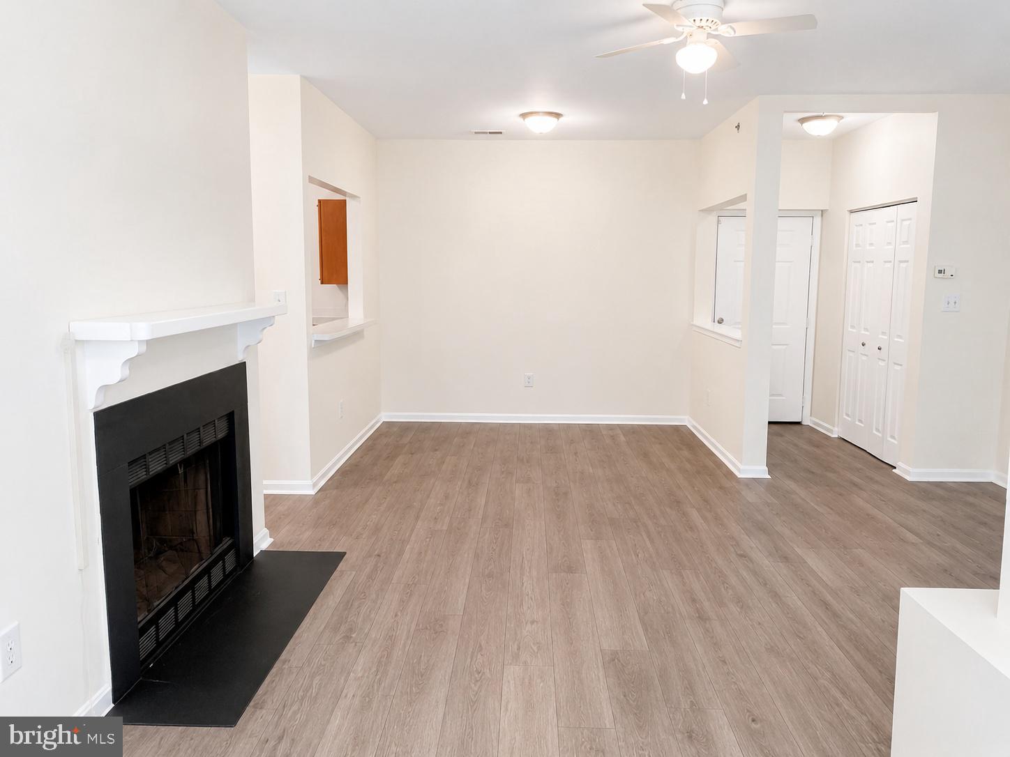 604 Moonglow Road, Unit 102 Odenton, MD 21113 - Photo 9 of 27 Spacious living area with cozy fireplace.