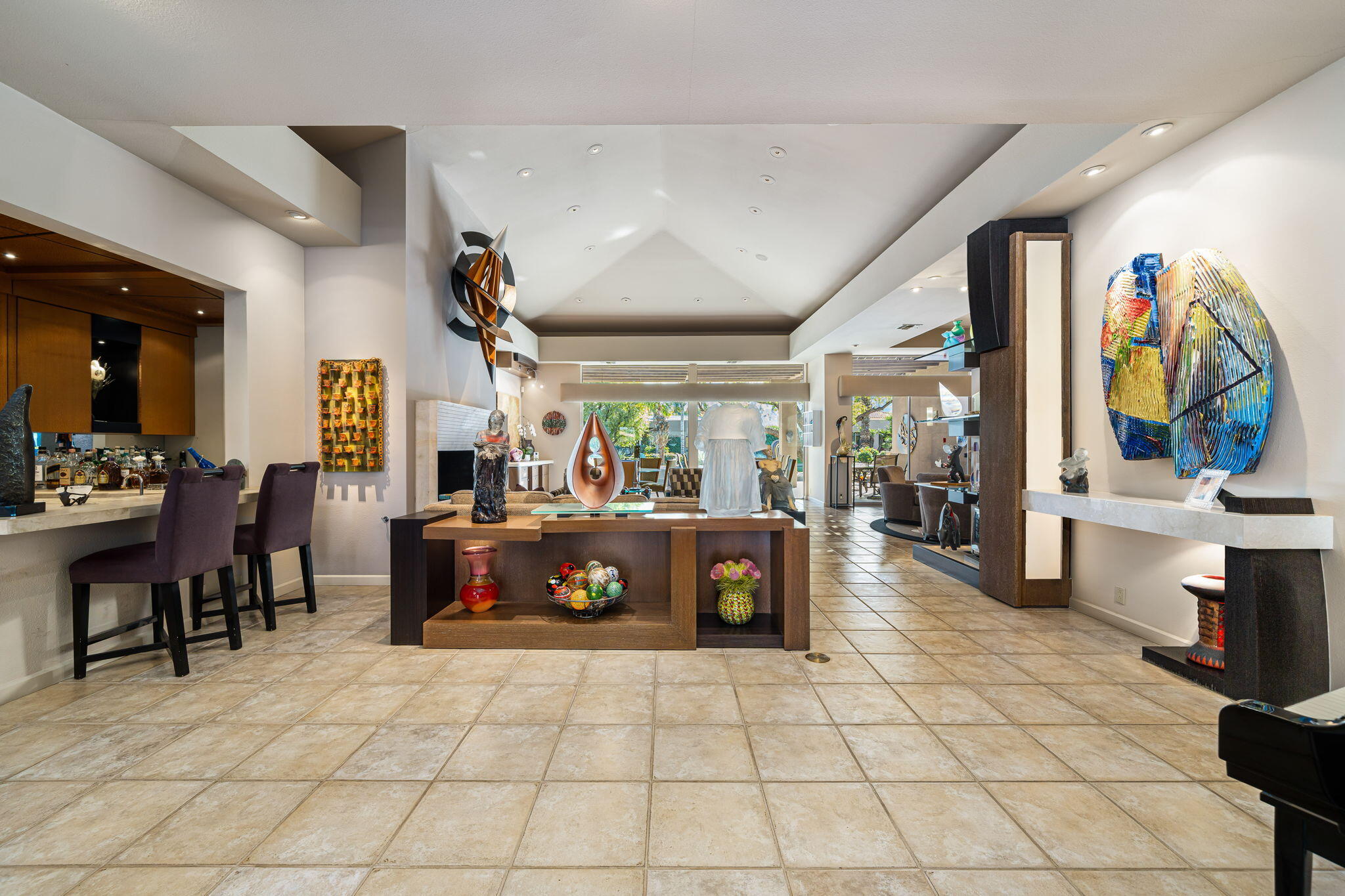 206 Crystal Bay Court Rancho Mirage, CA 92270 - Photo 16 of 62 a view of a dining hall with furniture and a large window