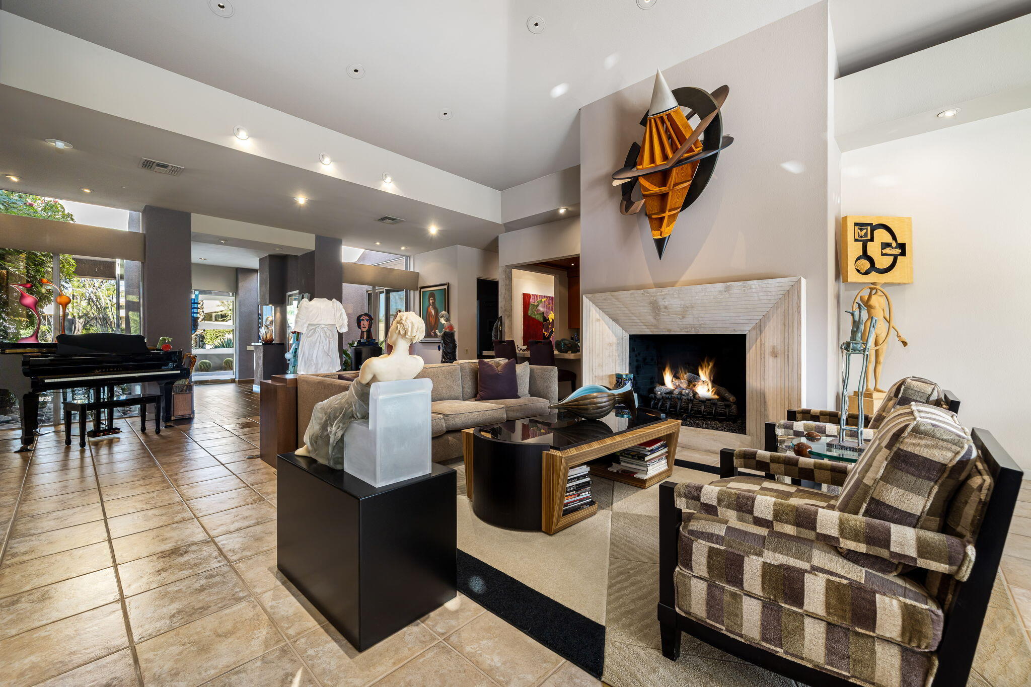 206 Crystal Bay Court Rancho Mirage, CA 92270 - Photo 18 of 62 a living room with furniture a fireplace and kitchen view